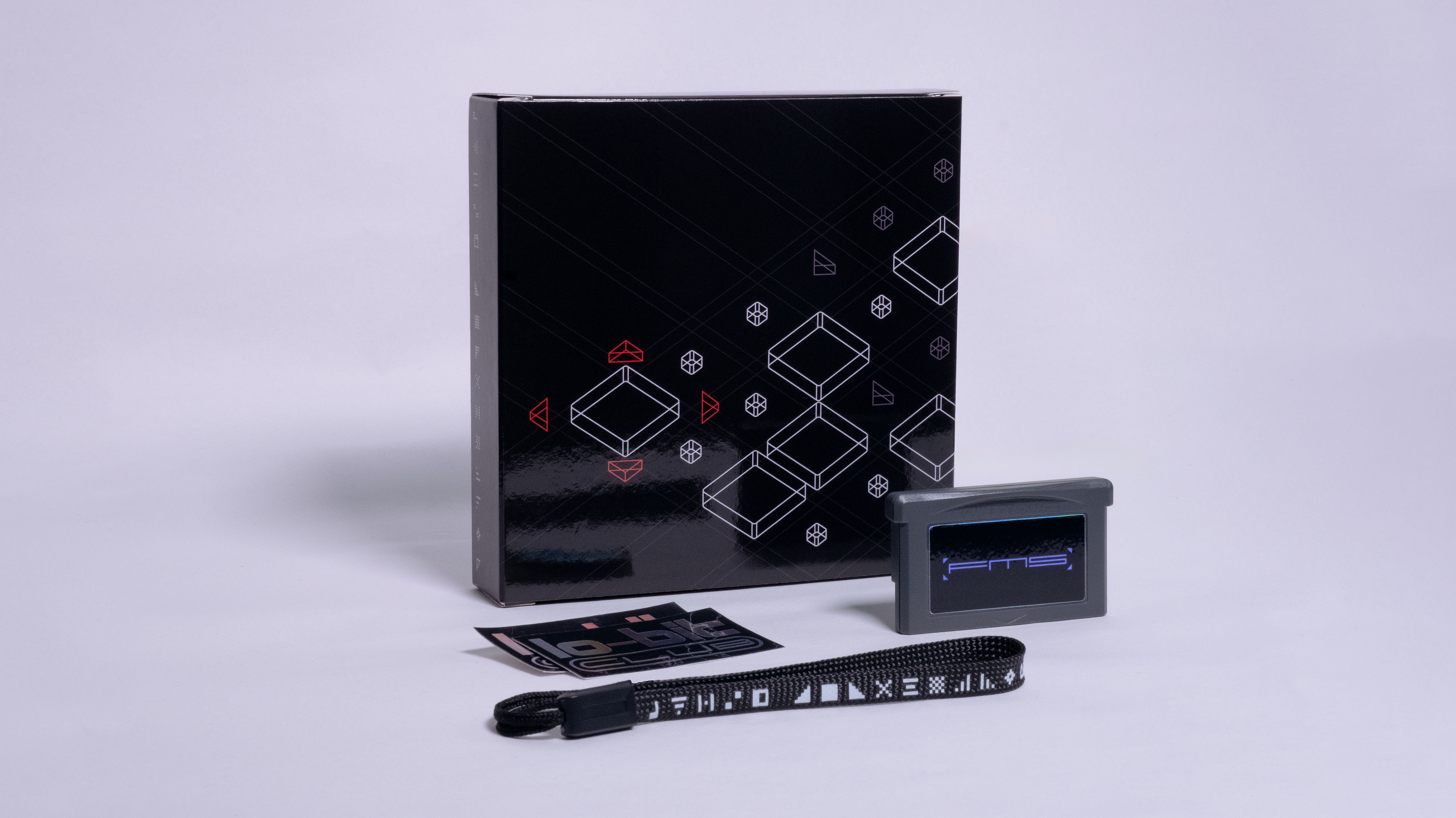 FMS physical release, with reproduction box featuring original artwork, Lo-Bit Club stickers and a carrying strap